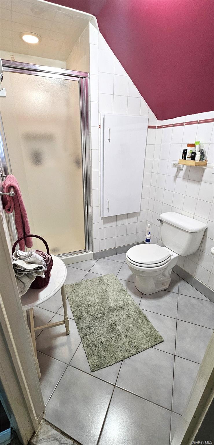80 Dobson Avenue Merrick, NY 11566 - Photo 21 of 21 a view of a bathroom with a sink and glass door