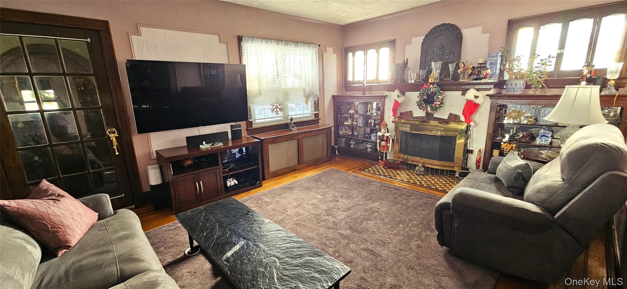 80 Dobson Avenue Merrick, NY 11566 - Photo 8 of 21 a living room with furniture and a flat screen tv