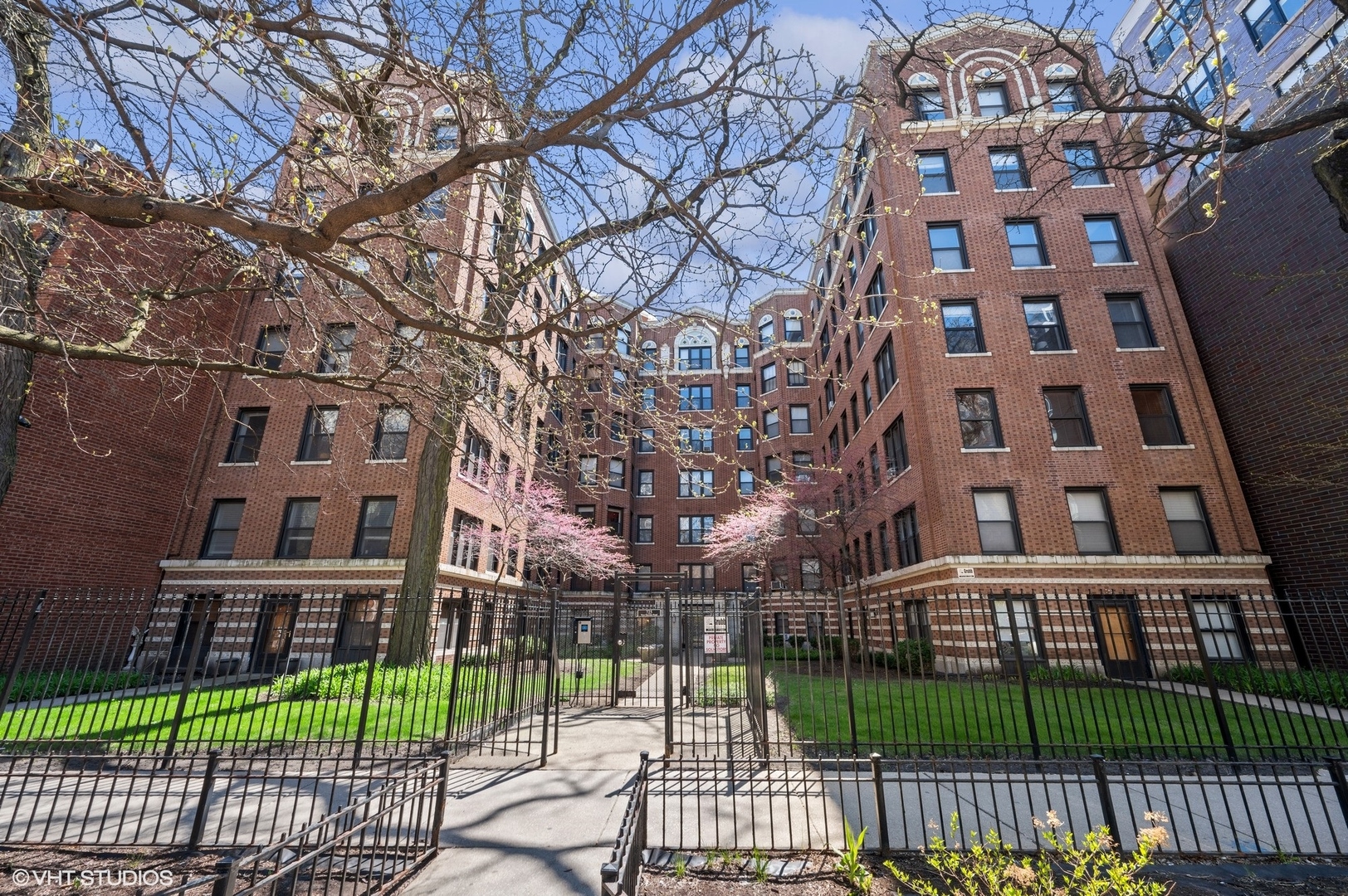 725 West Sheridan Road, Unit 603 Chicago, IL 60613 - Photo 1 of 16 a view of a brick building next to a yard