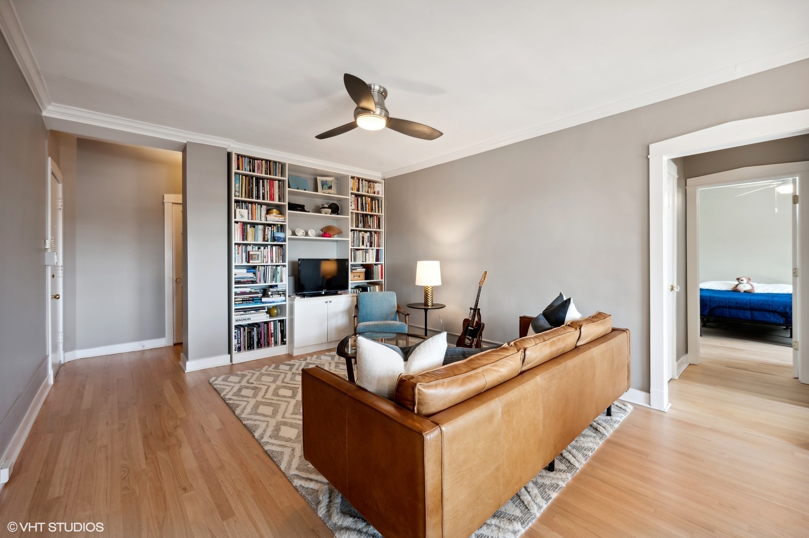 725 West Sheridan Road, Unit 603 Chicago, IL 60613 - Photo 4 of 16 a living room with furniture and a wooden floor