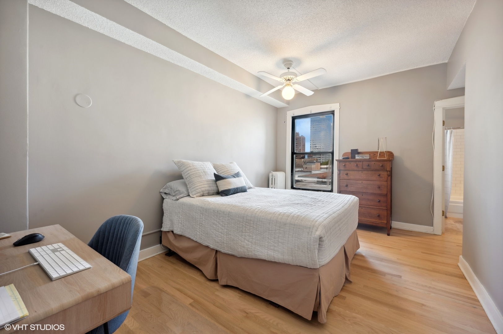 725 West Sheridan Road, Unit 603 Chicago, IL 60613 - Photo 9 of 16 a bedroom with a bed and furniture
