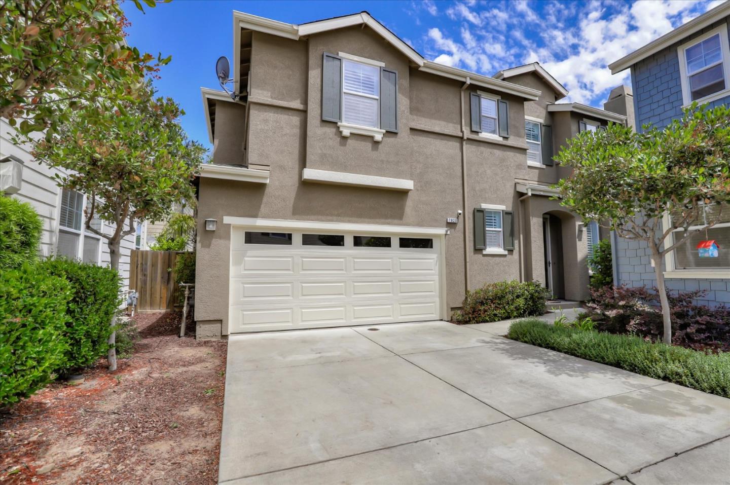 a front view of a house with garden