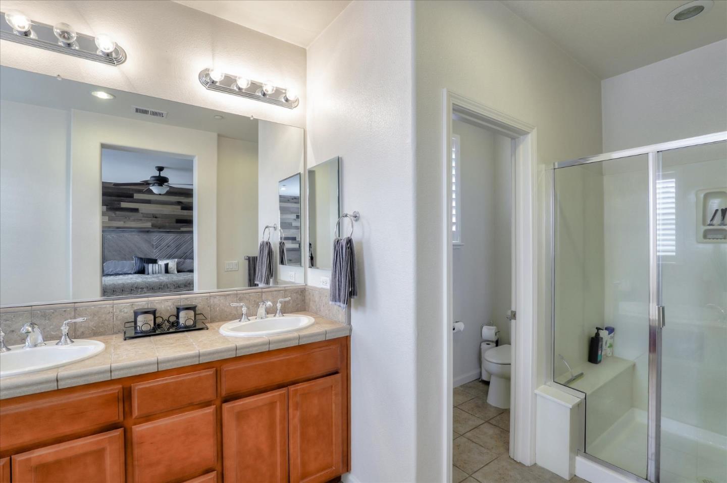 7820 Dickens Way Gilroy, CA 95020 - Photo 18 of 27 a bathroom with a double vanity sink mirror and double