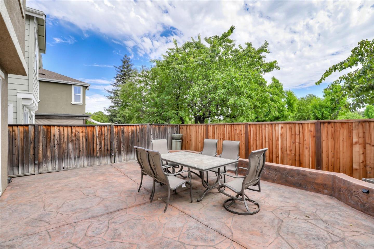 7820 Dickens Way Gilroy, CA 95020 - Photo 22 of 27 a view of a chairs and table in backyard