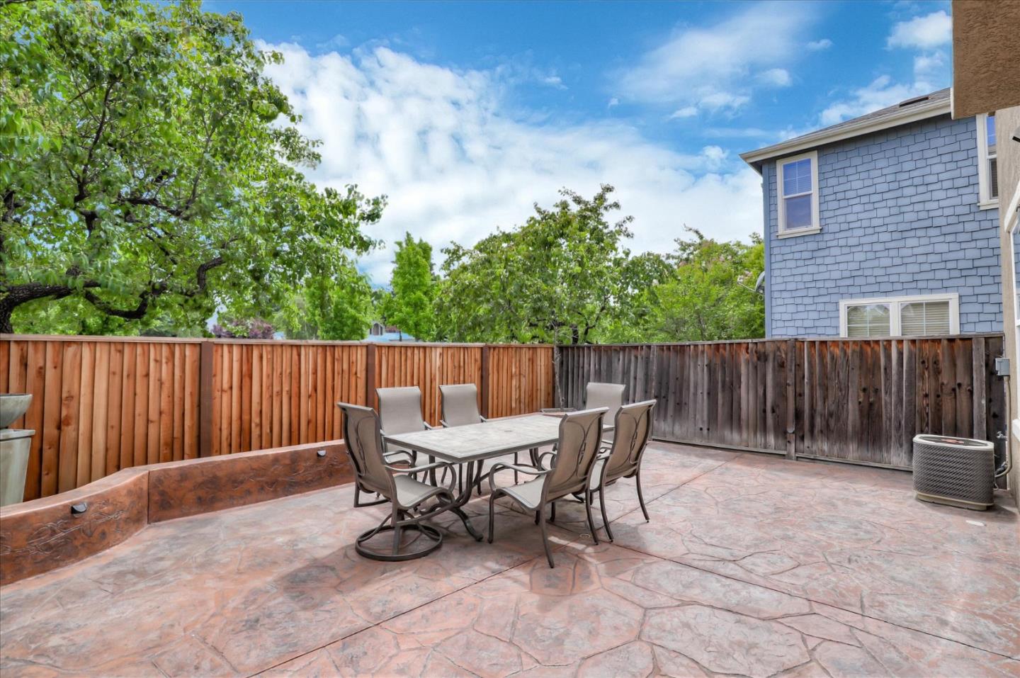 7820 Dickens Way Gilroy, CA 95020 - Photo 24 of 27 a view of backyard with a chair and potted plants