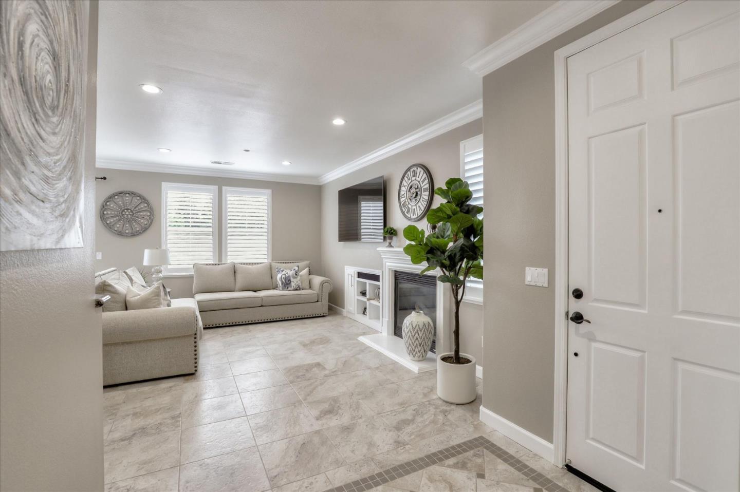 7820 Dickens Way Gilroy, CA 95020 - Photo 4 of 27 a living room with furniture and a potted plant