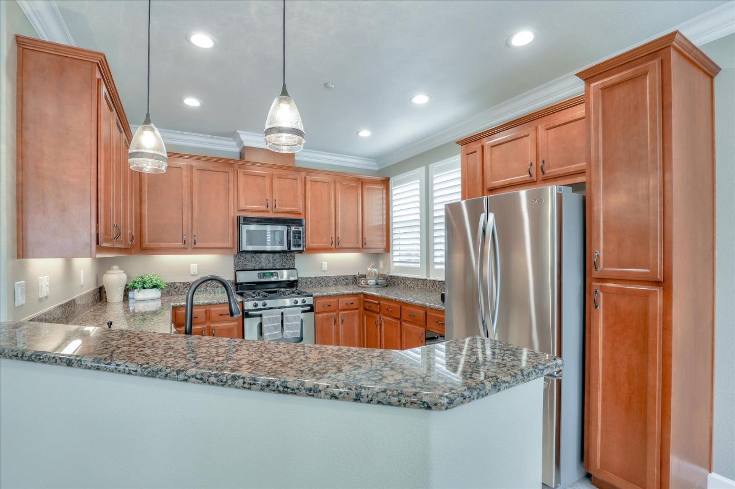 7820 Dickens Way Gilroy, CA 95020 - Photo 6 of 27 a kitchen with stainless steel appliances granite countertop a refrigerator and a sink