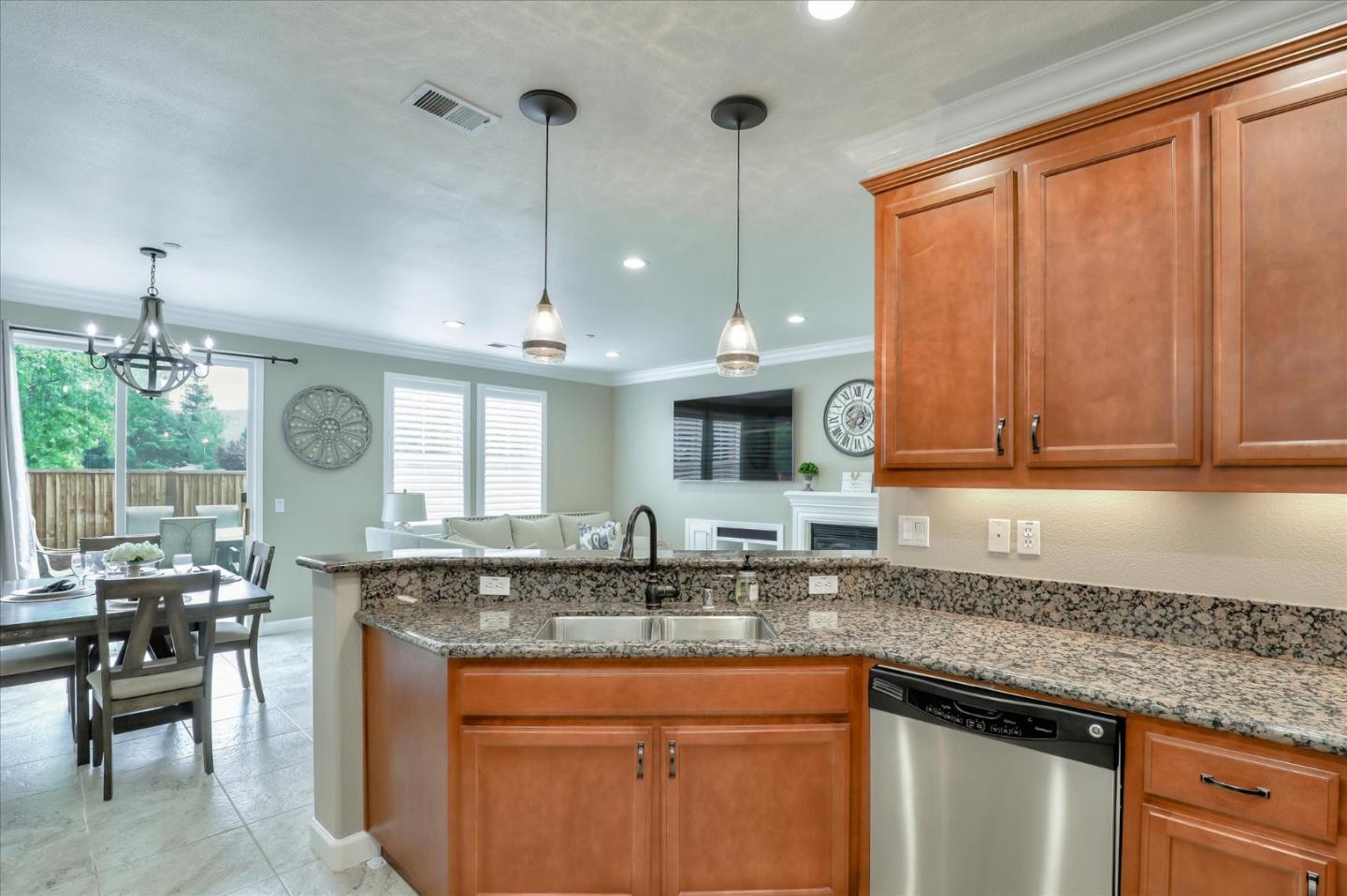 7820 Dickens Way Gilroy, CA 95020 - Photo 9 of 27 a kitchen with granite countertop a sink a stove and cabinets