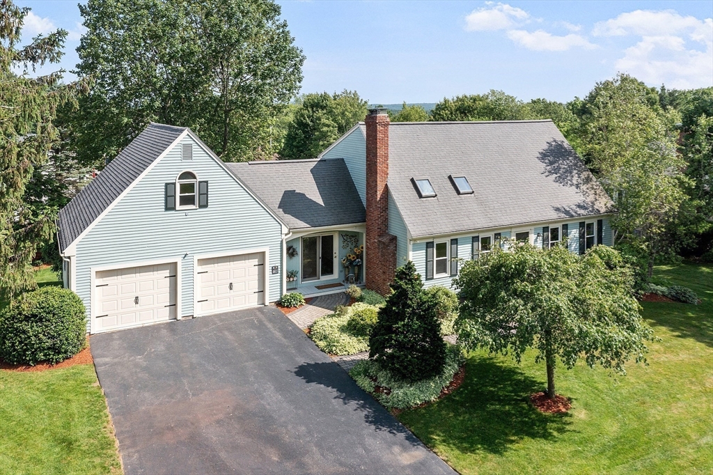 3 Sycamore Drive Rutland, MA 01543 - Photo 3 of 42 a front view of a house with a yard and garage