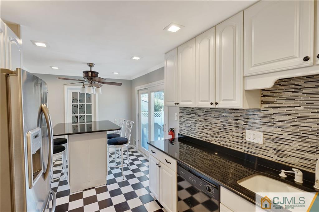 34 Mercer Road Old Bridge, NJ 08857 - Photo 8 of 27 a kitchen with stainless steel appliances a refrigerator and a sink