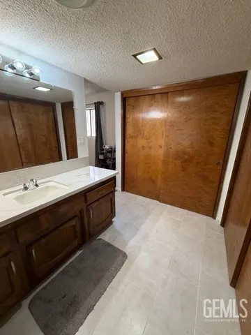 a bathroom with a sink a vanity and a mirror