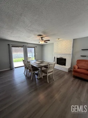 a view of a livingroom with furniture window and wooden floor