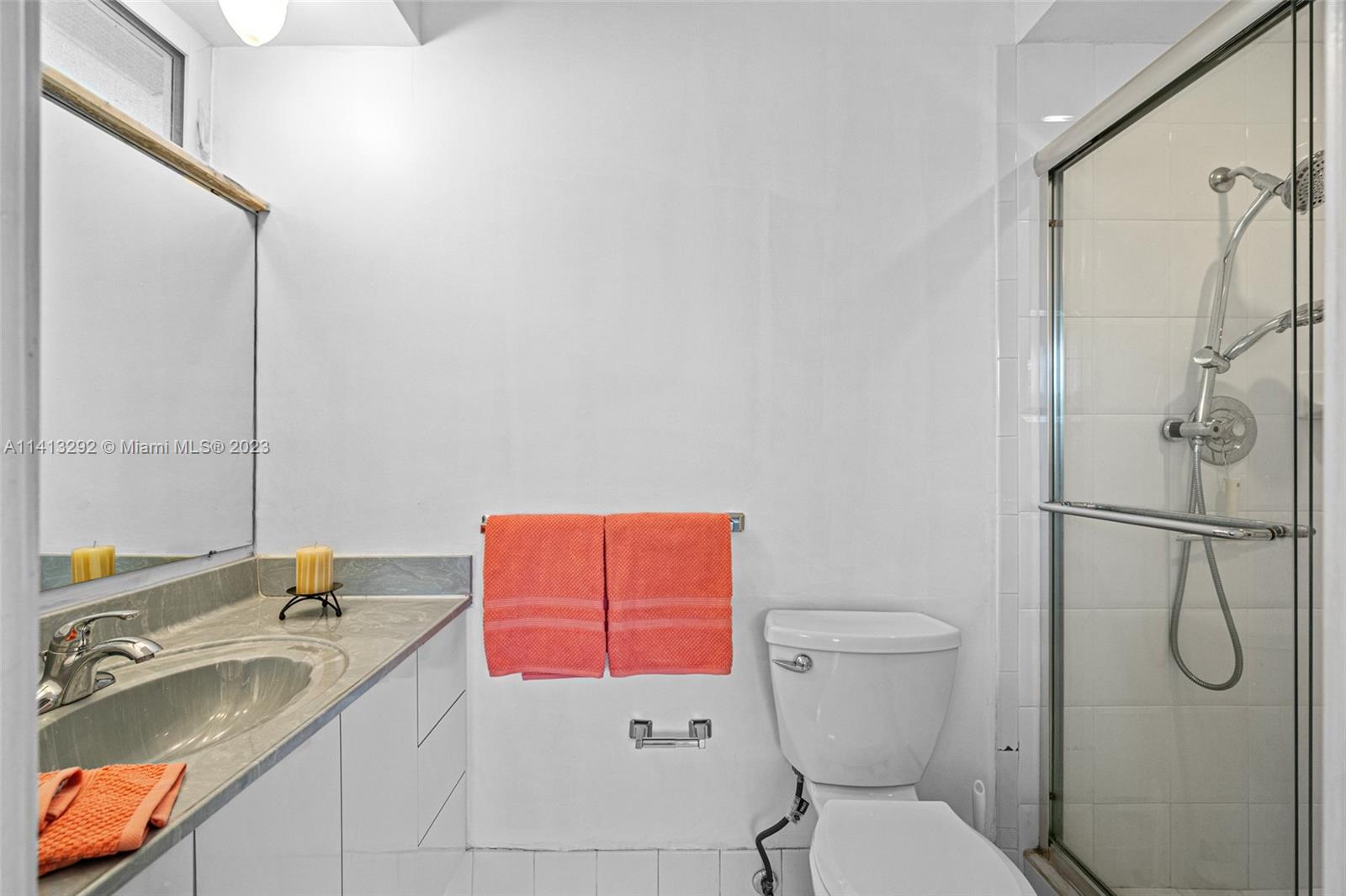 1260 Southwest 9th Street Boca Raton, FL 33486 - Photo 18 of 40 a bathroom with a sink toilet and shower