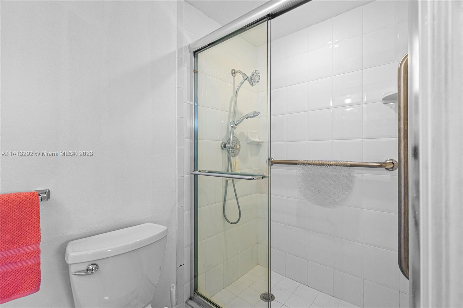 1260 Southwest 9th Street Boca Raton, FL 33486 - Photo 19 of 40 a bathroom with a glass shower door
