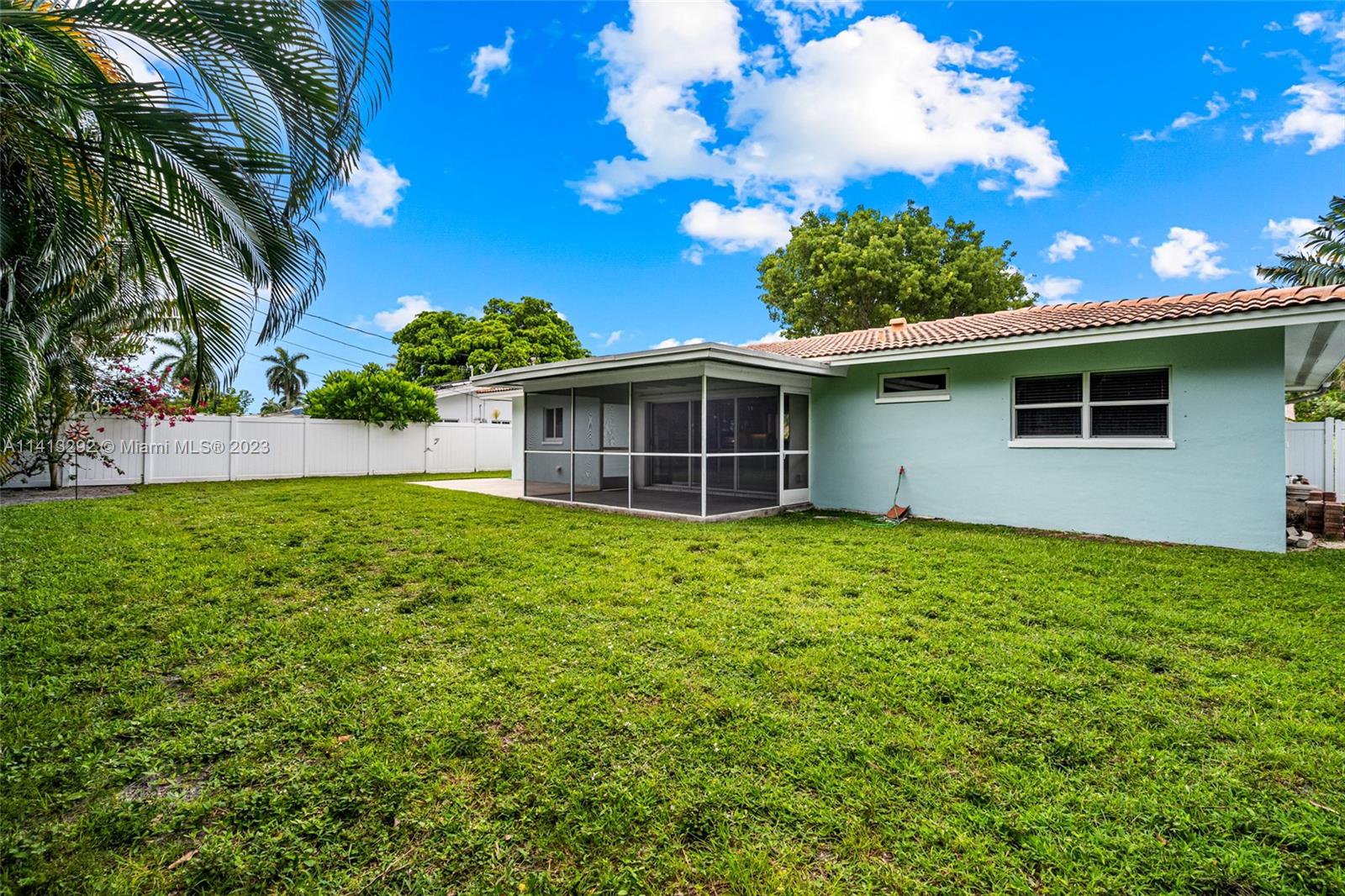 1260 Southwest 9th Street Boca Raton, FL 33486 - Photo 27 of 40 a view of a house with a backyard