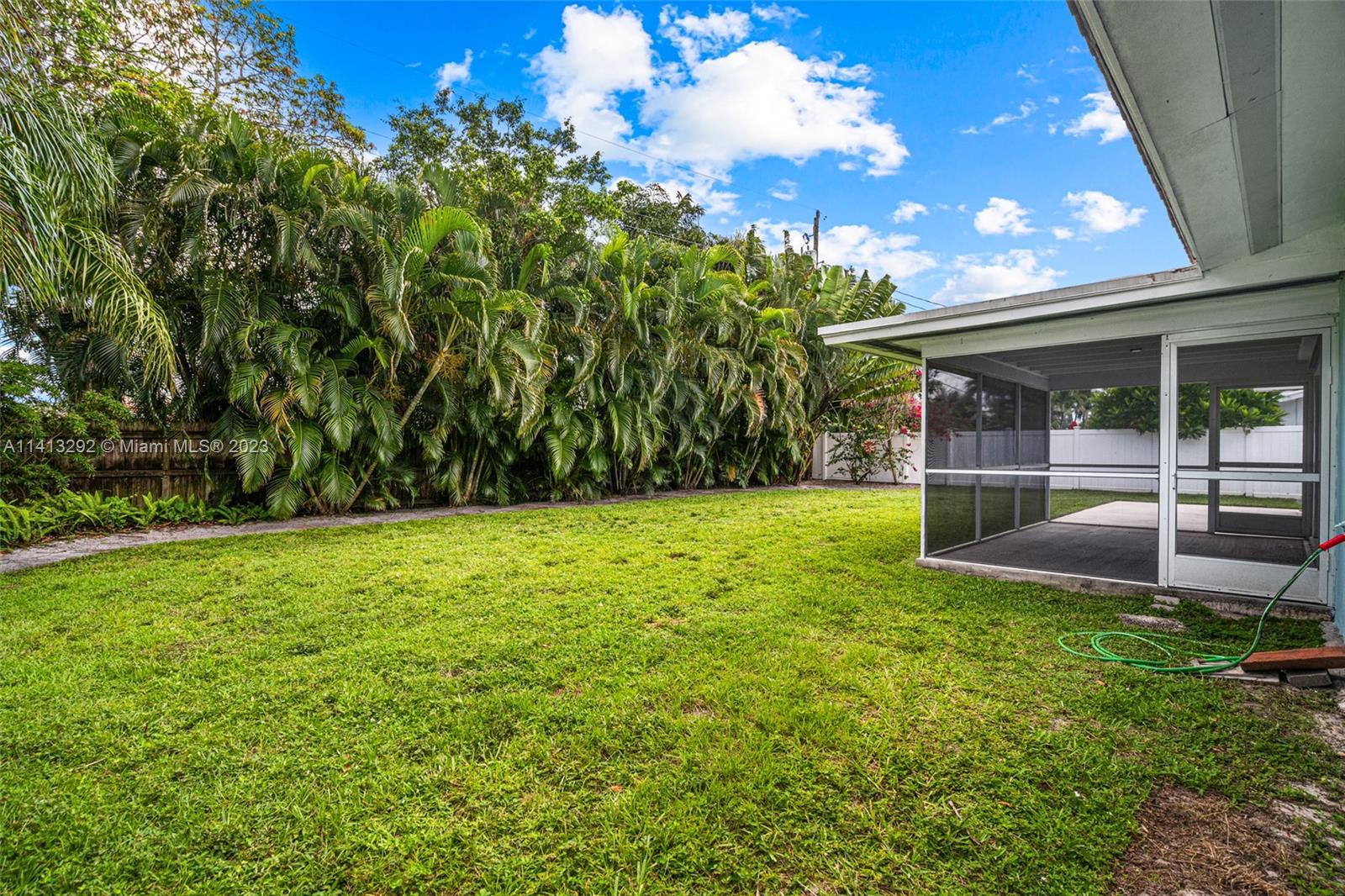 1260 Southwest 9th Street Boca Raton, FL 33486 - Photo 29 of 40 a view of a backyard with a garden