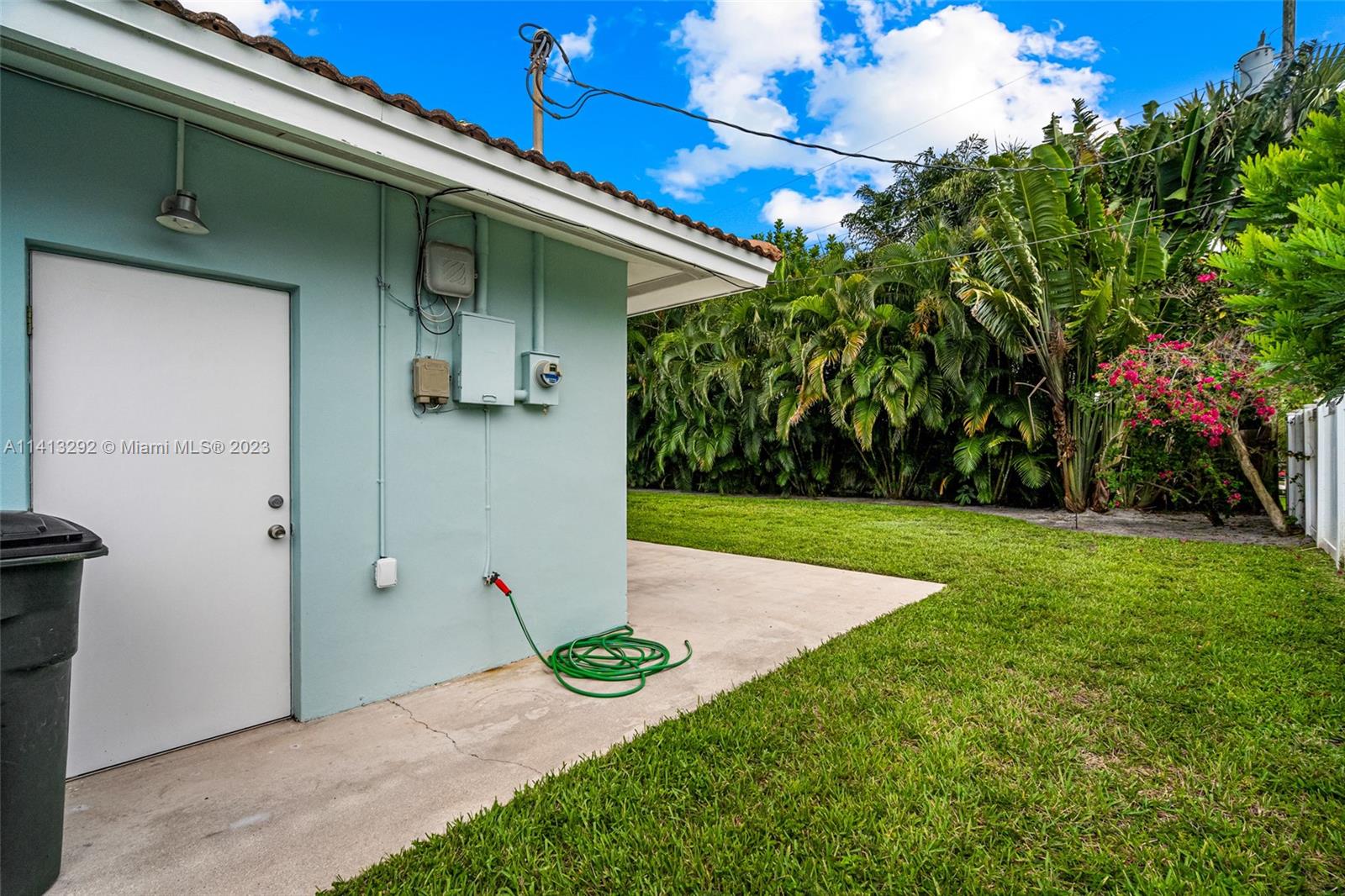 1260 Southwest 9th Street Boca Raton, FL 33486 - Photo 39 of 40 a view of yellow house with a yard