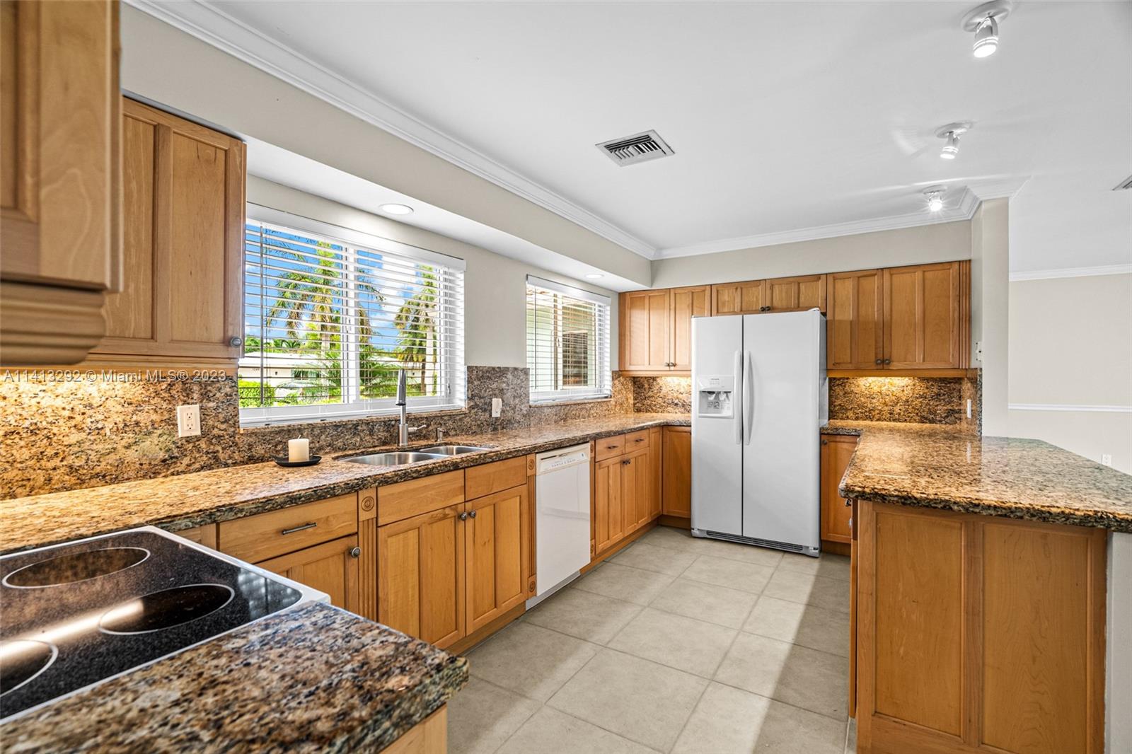 1260 Southwest 9th Street Boca Raton, FL 33486 - Photo 10 of 40 a kitchen with a sink stove and refrigerator