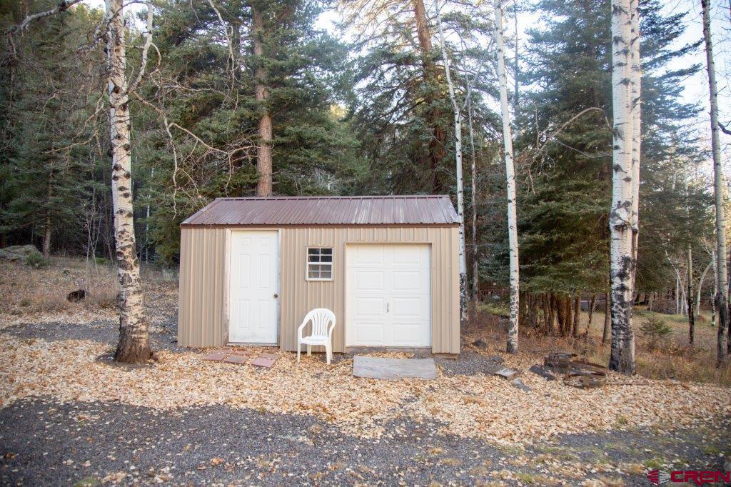 231 Forest Road Creede, CO 81130 - Photo 23 of 31 a front view of a house with garden