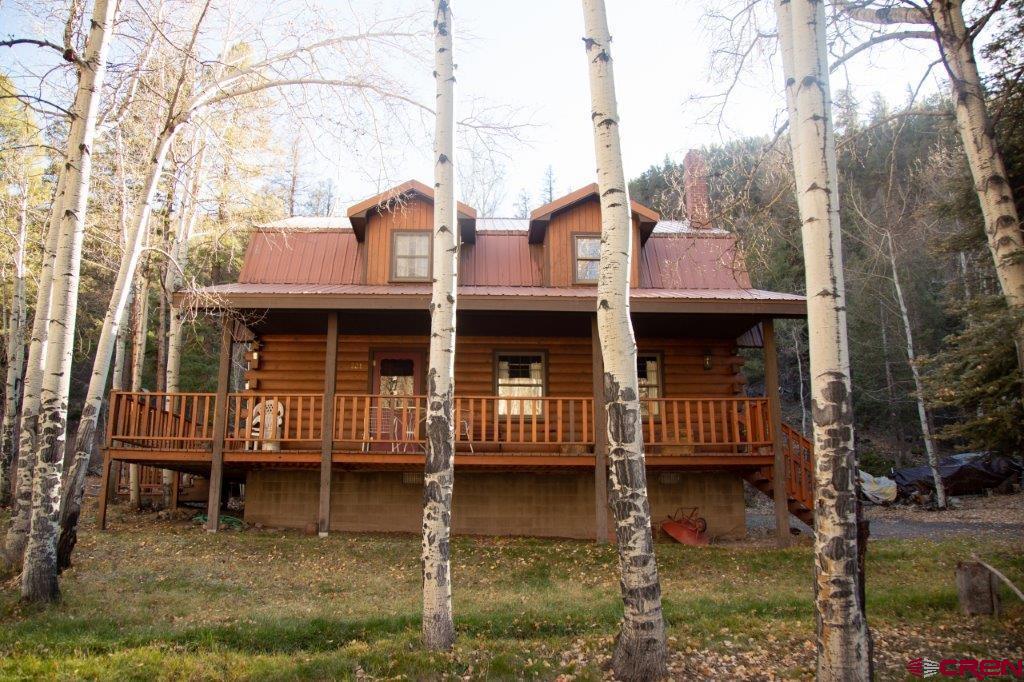 231 Forest Road Creede, CO 81130 - Photo 24 of 31 a front view of a house with a yard