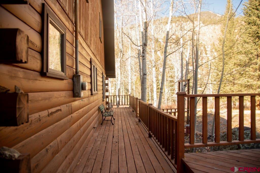 231 Forest Road Creede, CO 81130 - Photo 4 of 31 a view of balcony with wooden floor and fence