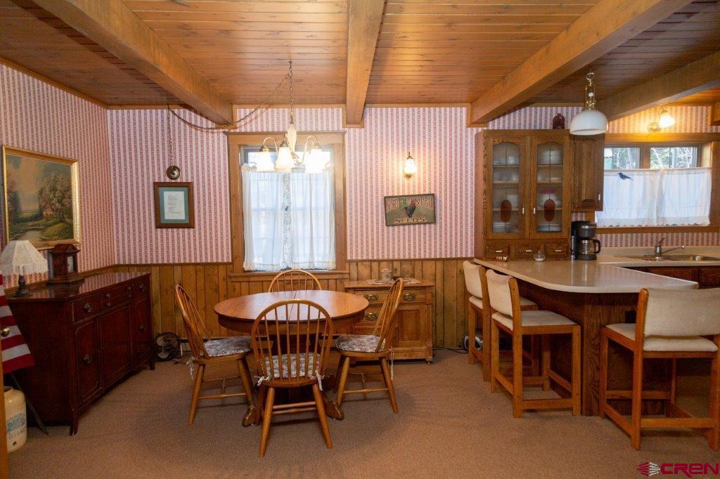 231 Forest Road Creede, CO 81130 - Photo 8 of 31 a dining room with furniture and window