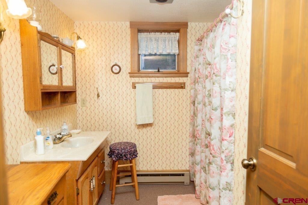 231 Forest Road Creede, CO 81130 - Photo 9 of 31 a bathroom with a sink and a mirror
