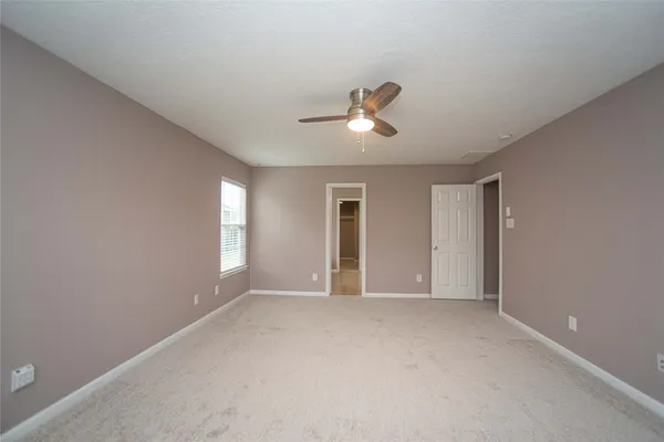 a view of empty room with windows