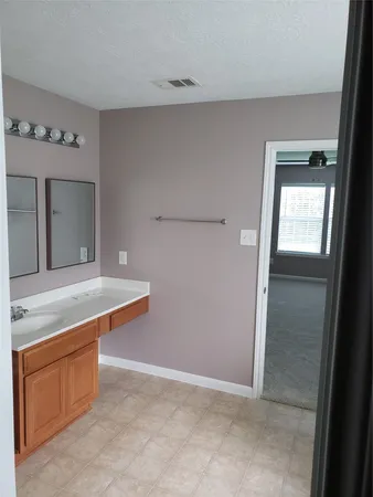 a bathroom with a bathtub and a sink