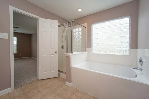 a view of staircase with fireplace