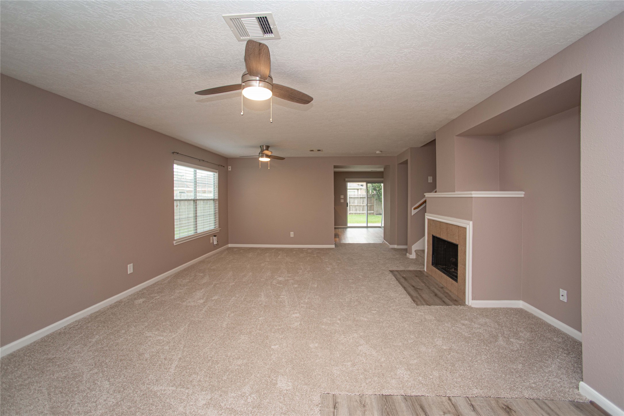 29314 Legends Bluff Drive Spring, TX 77386 - Photo 4 of 26 a view of empty room with fireplace and window