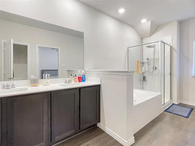 a bathroom with a double vanity sink mirror and double