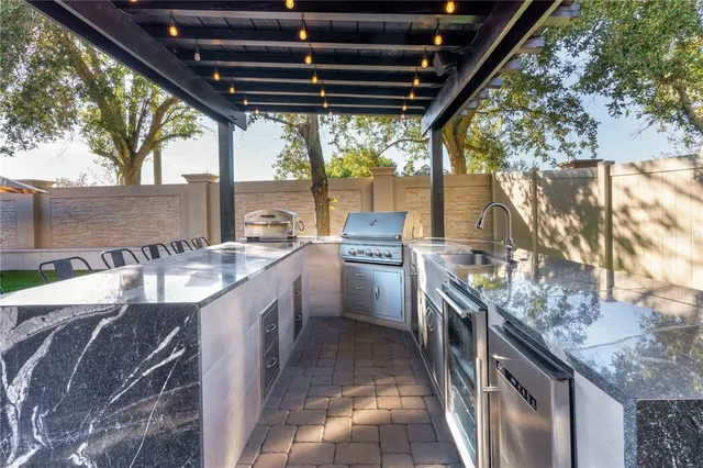 a aerial view of a house with a yard and lake view