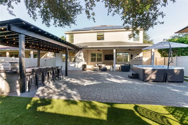 an aerial view of a house with a swimming pool