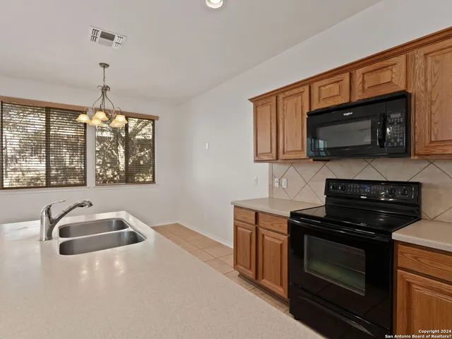 a view of empty room with cabinet