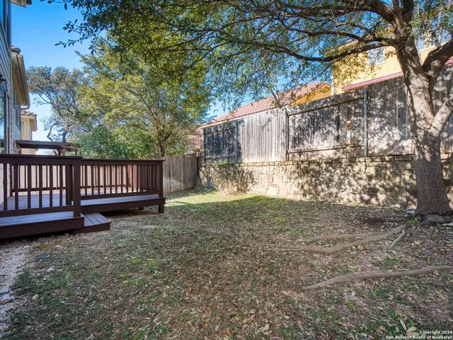 a view of a swimming pool with outdoor seating
