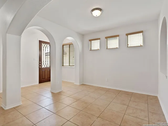 a kitchen with stainless steel appliances a refrigerator sink and cabinets