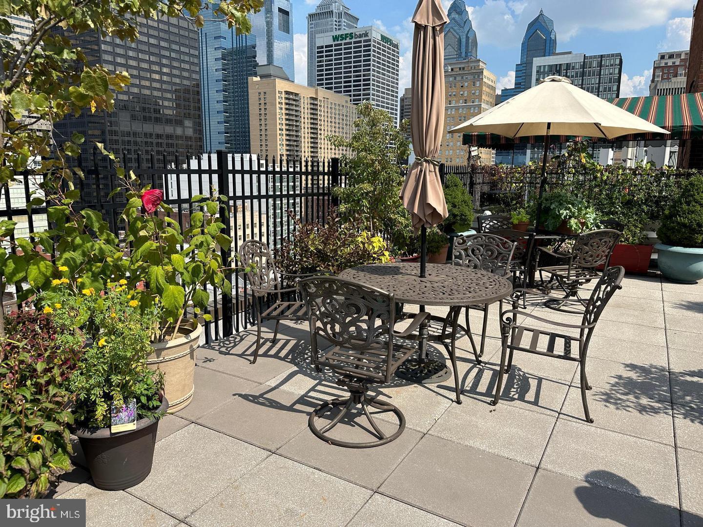 118 South 21st Street, Unit 603 Philadelphia, PA 19103 - Photo 12 of 14 a view of a chairs and table in backyard