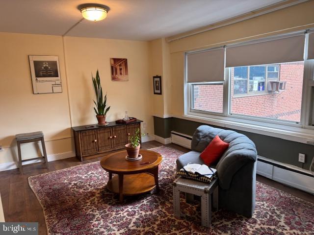 118 South 21st Street, Unit 603 Philadelphia, PA 19103 - Photo 3 of 14 a living room with furniture and a potted plant