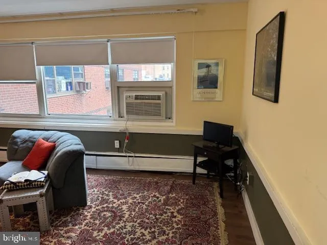 a room that has a bed and a chair in it