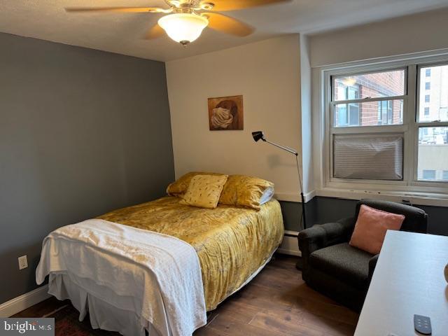 118 South 21st Street, Unit 603 Philadelphia, PA 19103 - Photo 10 of 14 a bedroom with a bed and window