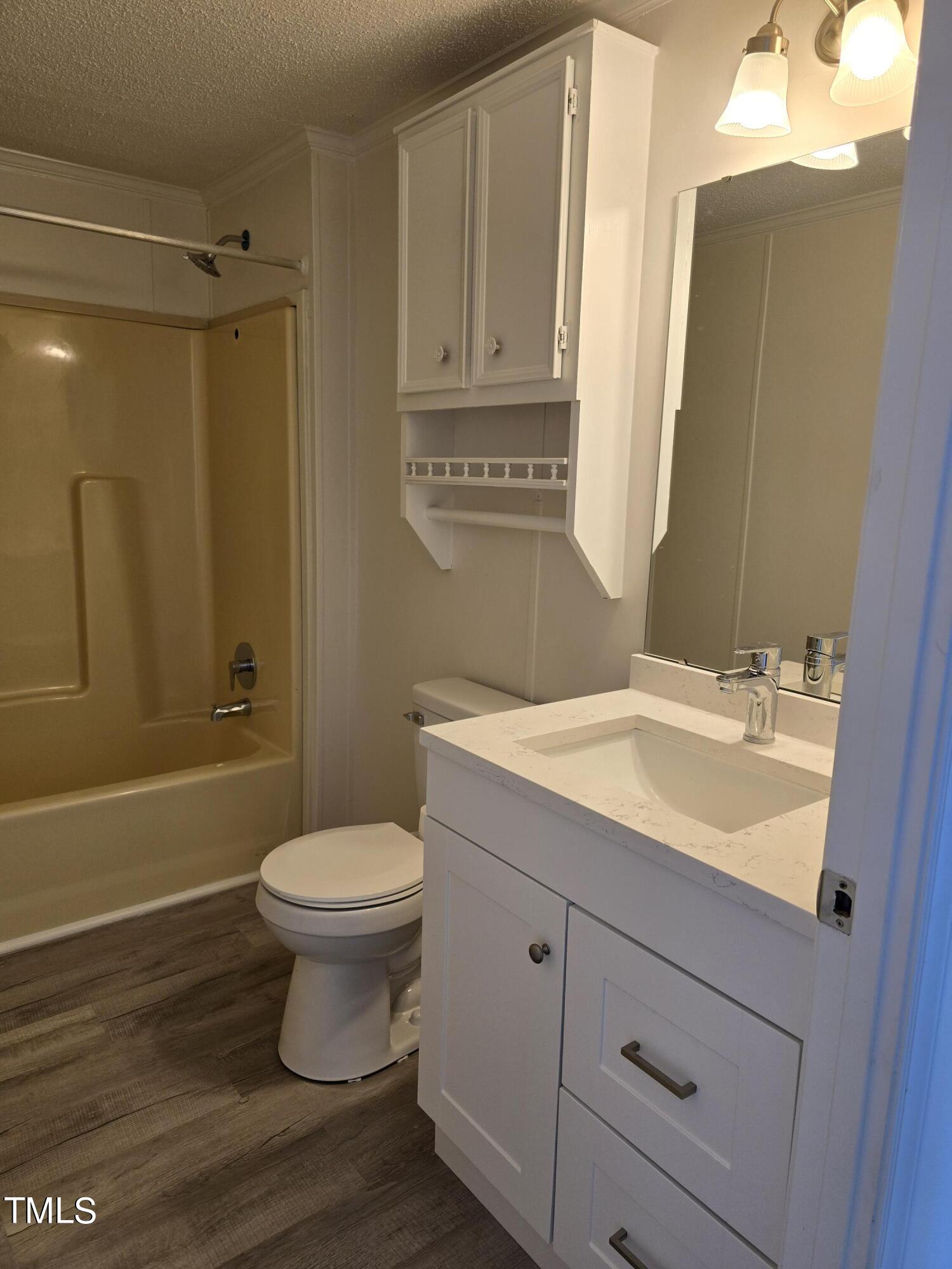 1096 Worthville Road Randleman, NC 27317 - Photo 17 of 20 a bathroom with a sink toilet and shower