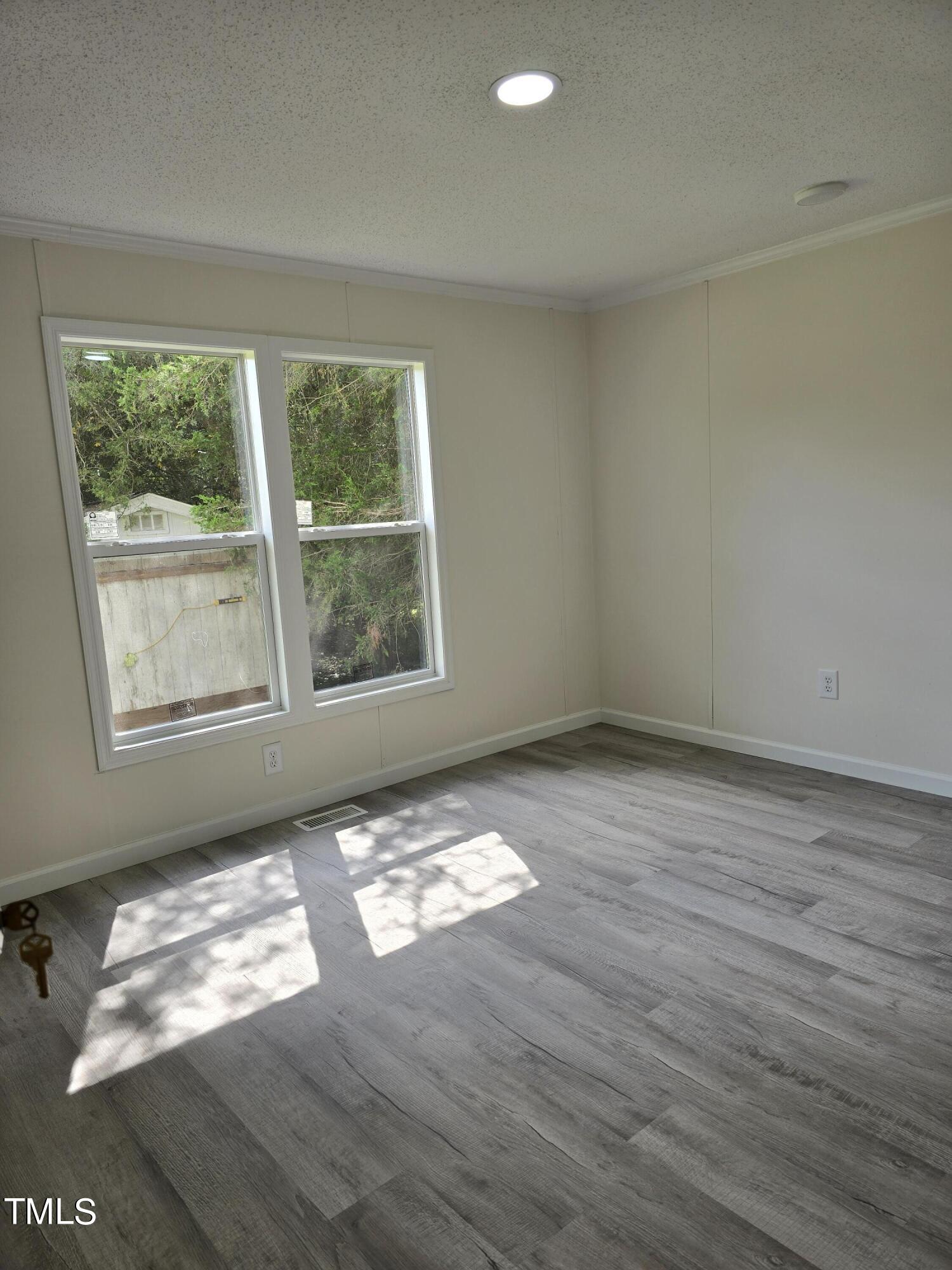 1096 Worthville Road Randleman, NC 27317 - Photo 18 of 20 a view of an empty room and window