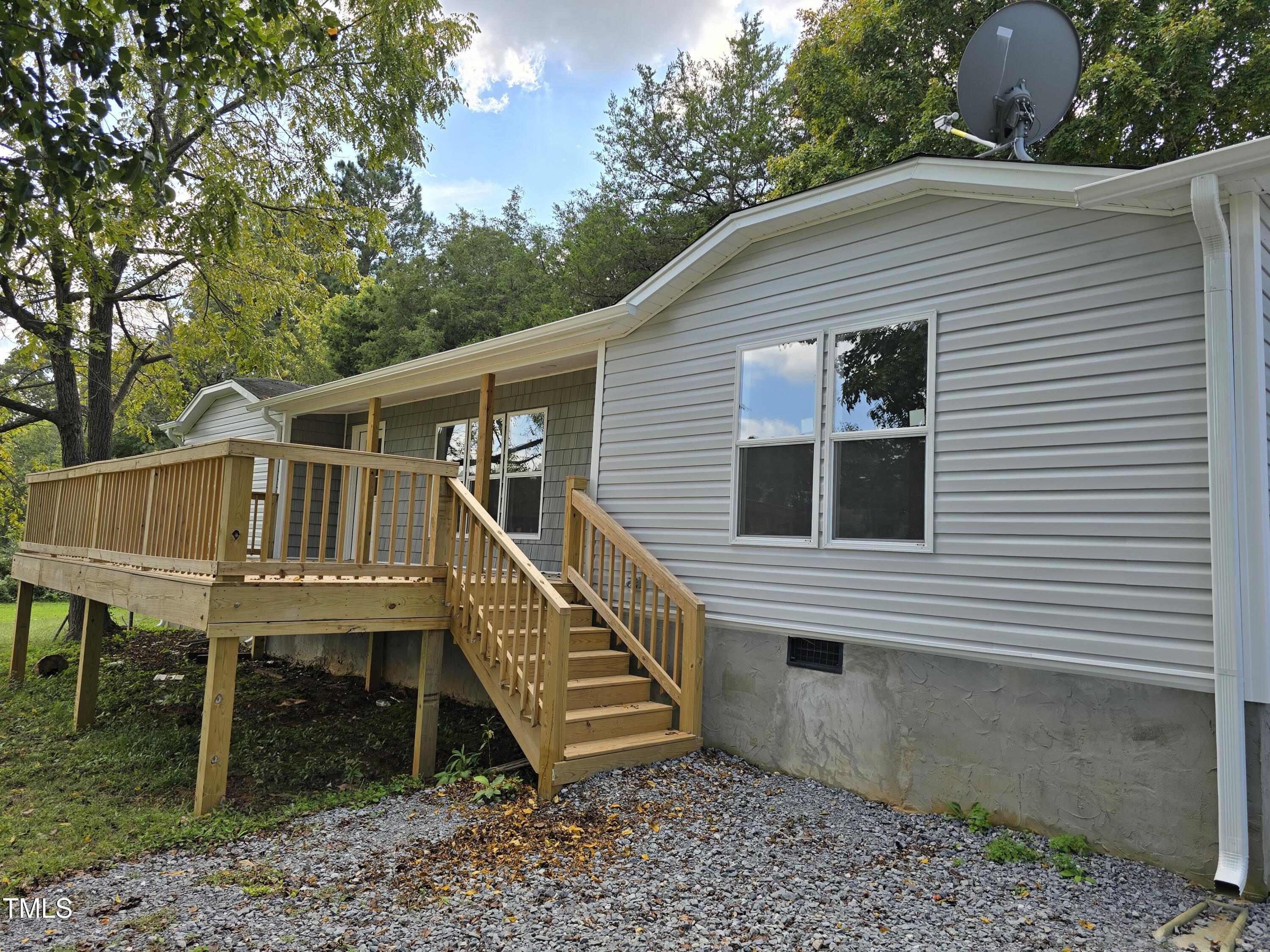 1096 Worthville Road Randleman, NC 27317 - Photo 2 of 20 a view of a house with a balcony and stairs