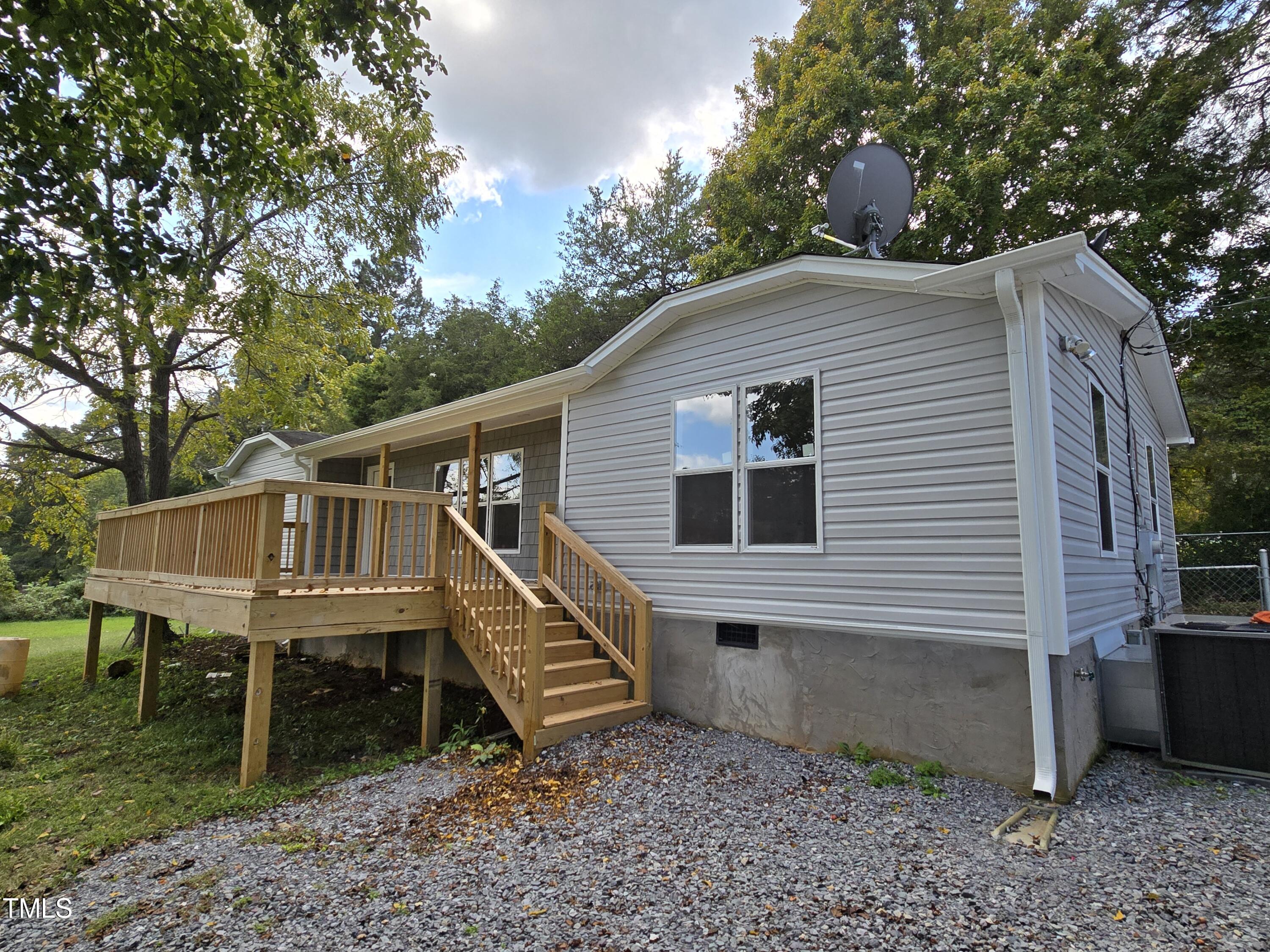 1096 Worthville Road Randleman, NC 27317 - Photo 3 of 20 a roof deck with a table and a barbeque