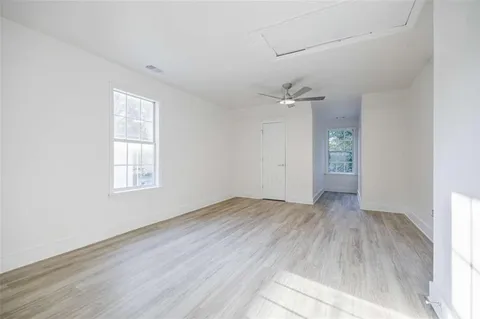an empty room with wooden floor