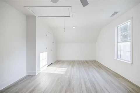 a view of a house with wooden deck