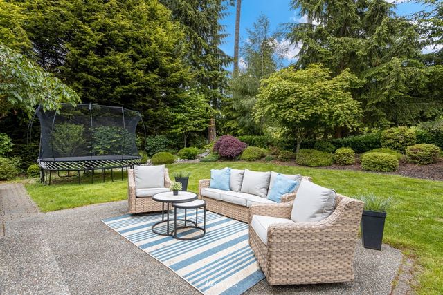 a front view of house with yard and seating area
