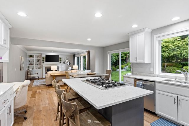 a view of a dining room with furniture and window