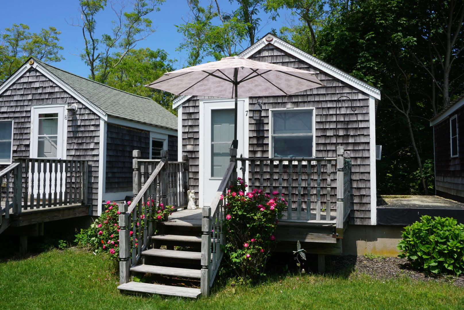 17 Shore Road, Unit 7 Truro, MA 02666 - Photo 2 of 11 a front view of a house with a yard